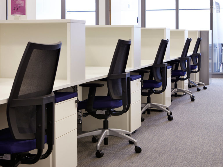 Bespoke desking with individual storage units and upholstered top pedestals