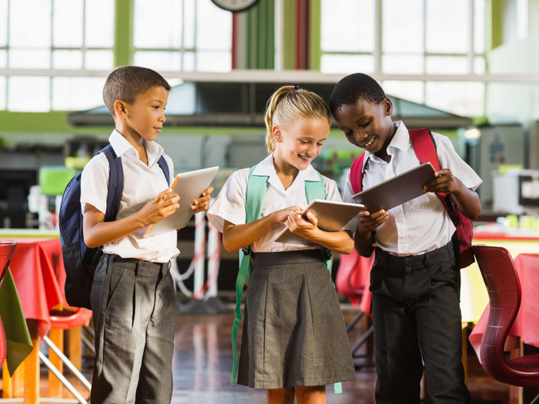 Self-directed learning - students with tablets in colourful learning environment